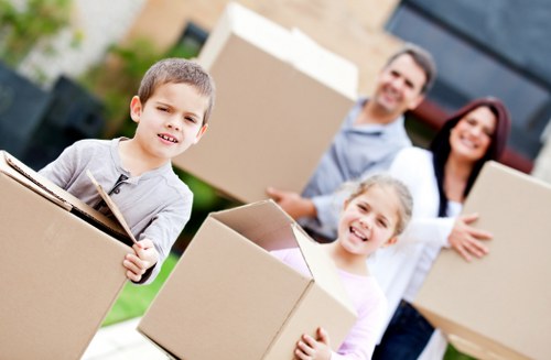 Loading furniture into a moving truck in Barnet