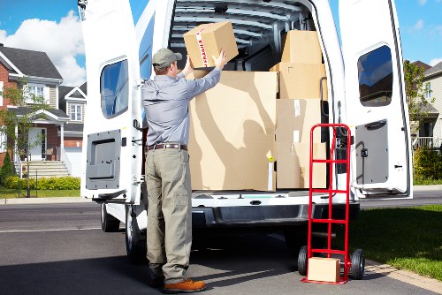 Mover carrying furniture during a house move