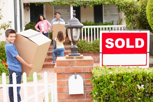 Local moving crew handling furniture in a Barnet property
